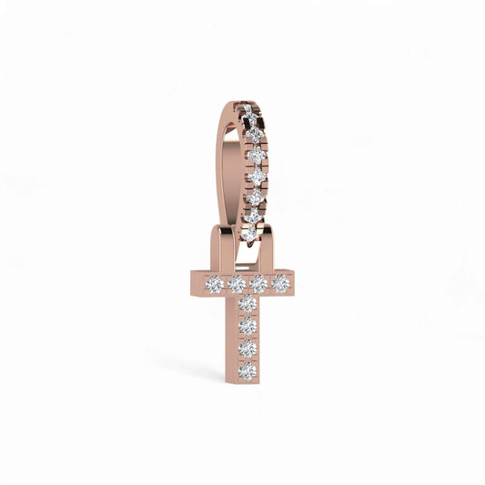 Rose gold cross-shaped earring with diamonds on a white background