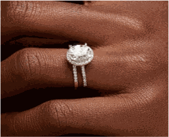 Irene Oval Cut CZ engagement ring in 10K gold with 5A cubic zirconia on hand