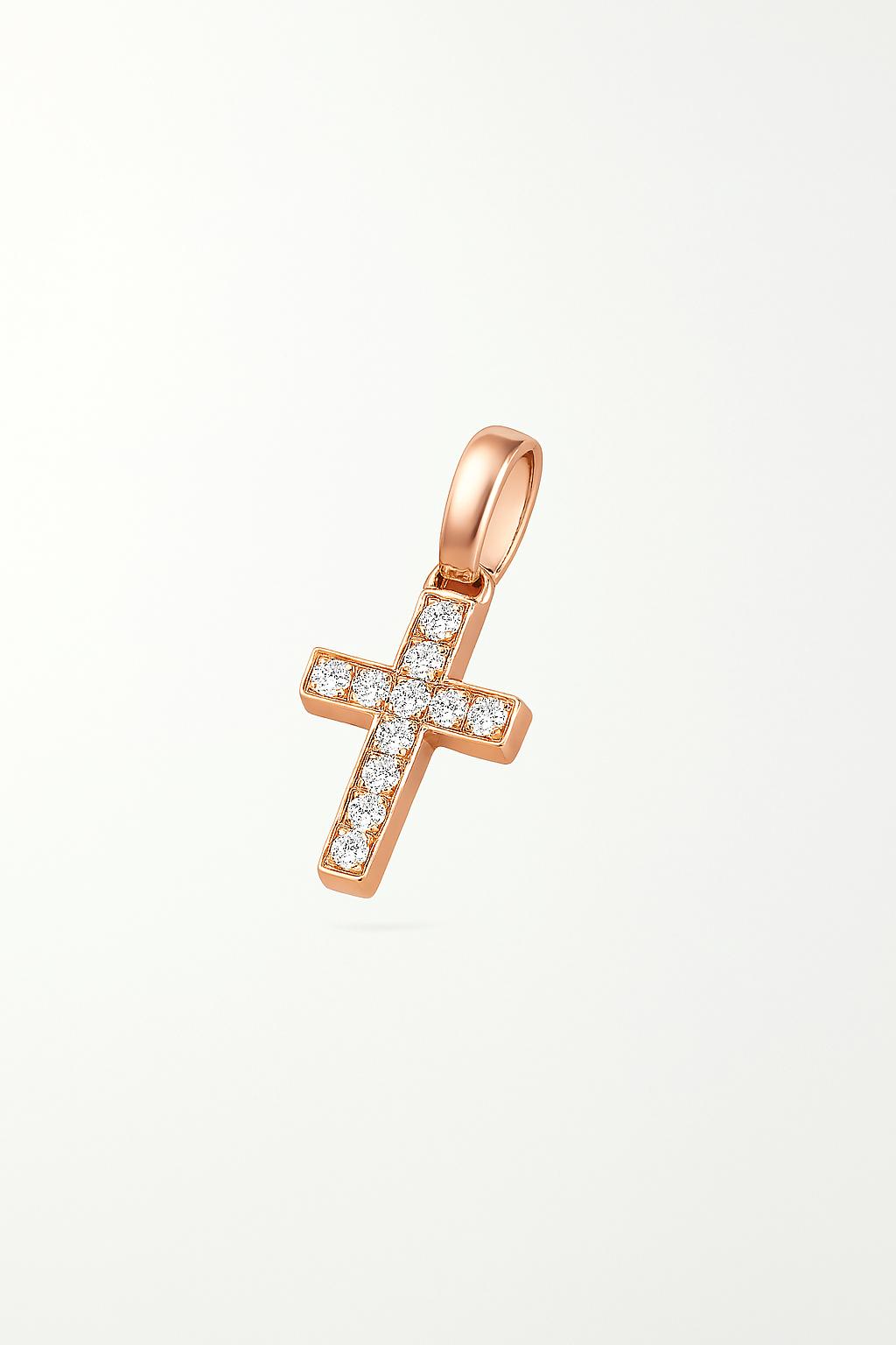 Rose gold cross pendant with diamonds on a light beige background