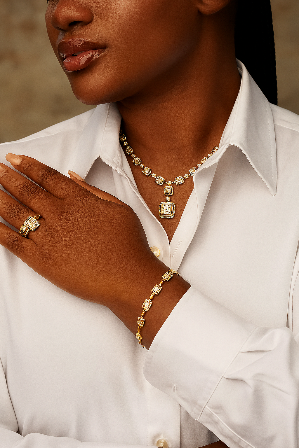 Close-up of a person wearing gold jewelry including a necklace, bracelet, and ring.
