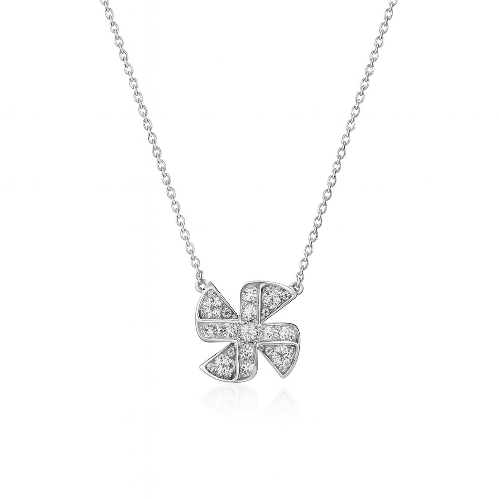 Silver necklace with a diamond-encrusted clover pendant on a white background