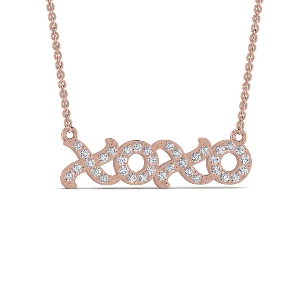 A 18 karat gold necklace with a natural diamond pendant in the shape of the letters 'XO'.
