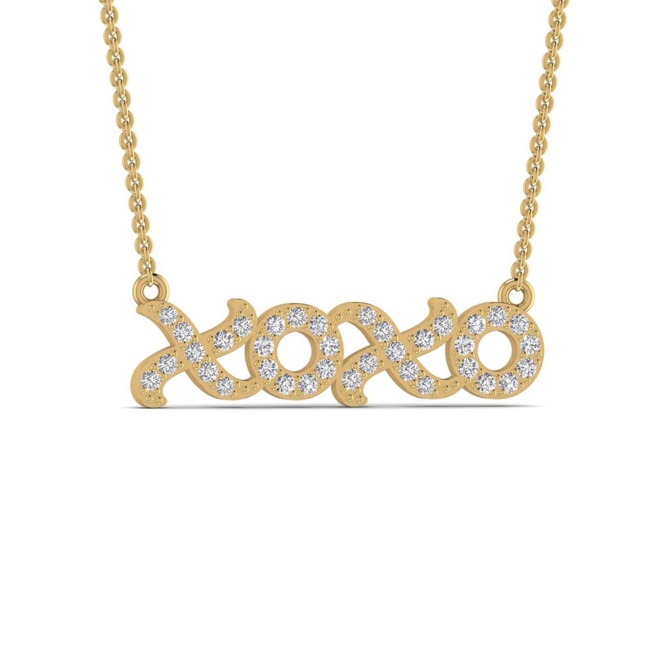 A 18 karat gold necklace with a natural diamond pendant in the shape of the letters 'XO'.