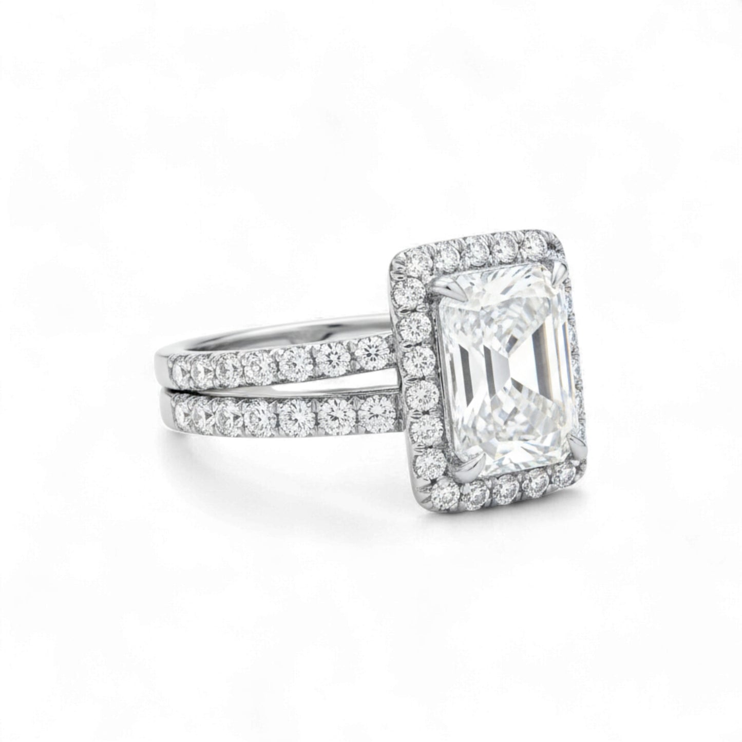 Diamond ring with a rectangular stone on a white background