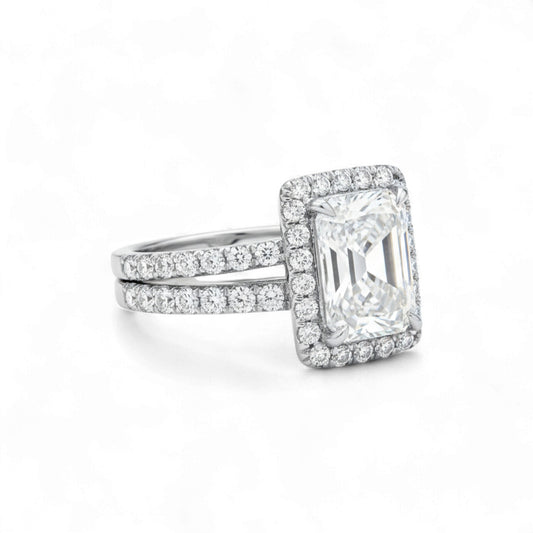 Diamond ring with a rectangular stone on a white background