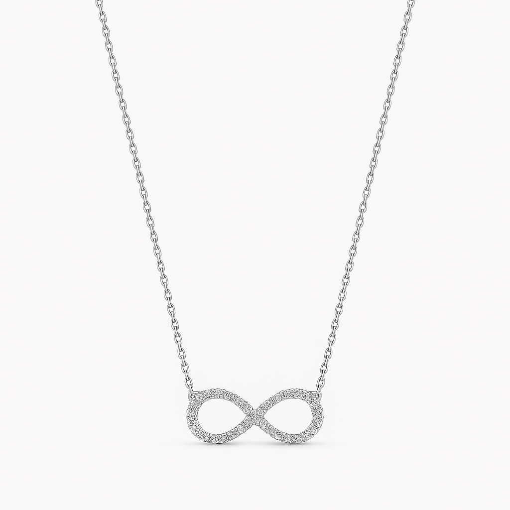 Silver infinity necklace on a light gray background