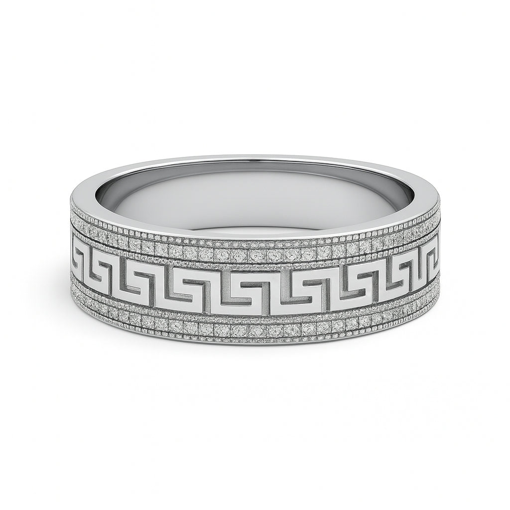 Silver ring with intricate design on a white background