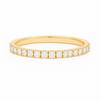 Gold ring with small diamonds on a white background