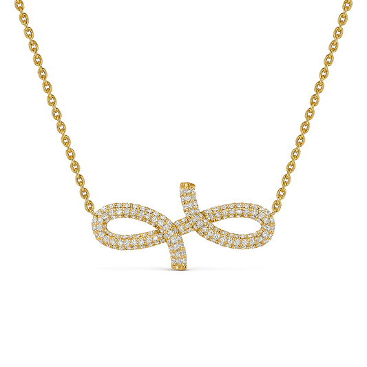Gold necklace with an infinity symbol pendant on a white background
