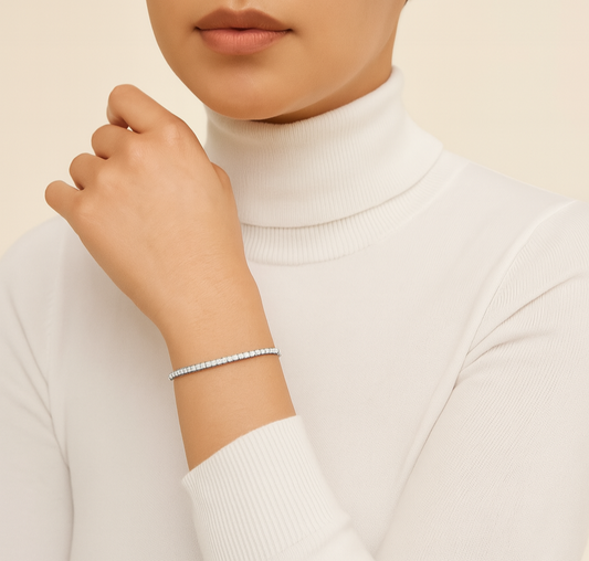 Woman wearing a white turtleneck sweater against a beige background