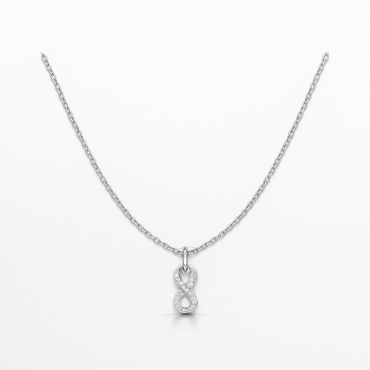 Silver infinity necklace on a white background