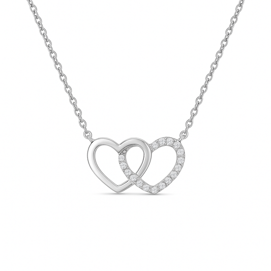 Silver necklace with interlocking heart pendants on a white background