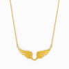 Gold wing-shaped necklace on a white background