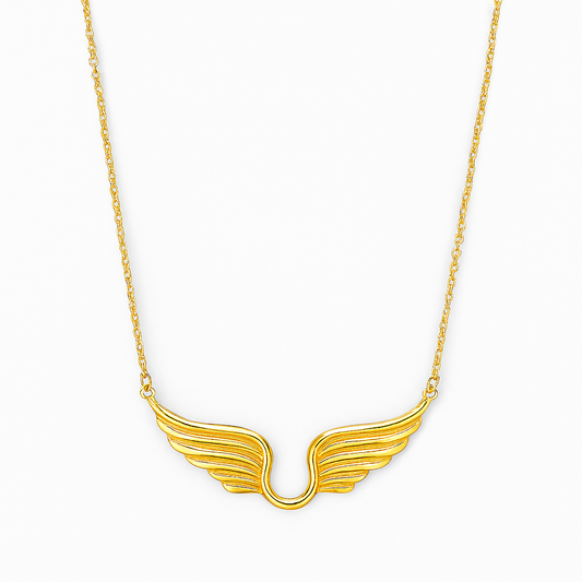 Gold wing-shaped necklace on a white background