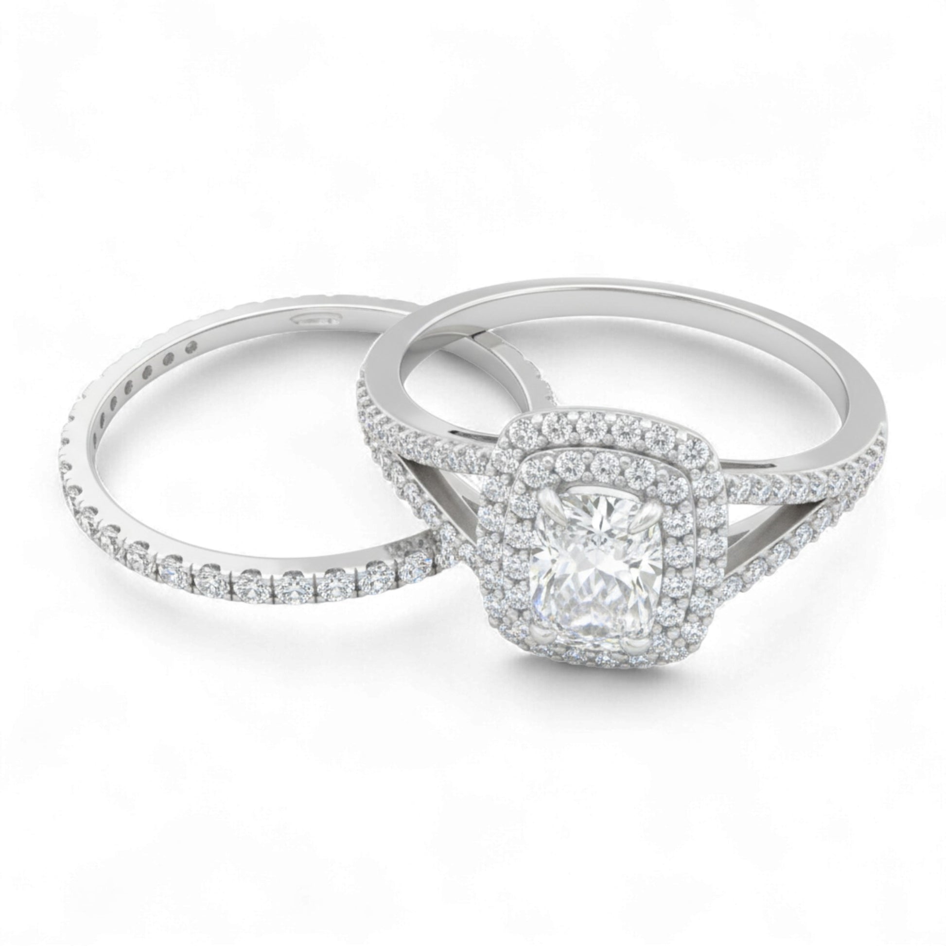 Two silver rings with diamond accents on a white background