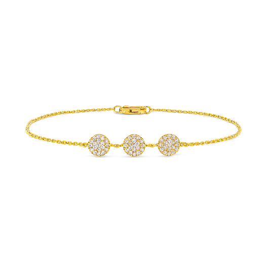 Gold bracelet with three diamond-studded charms on a white background