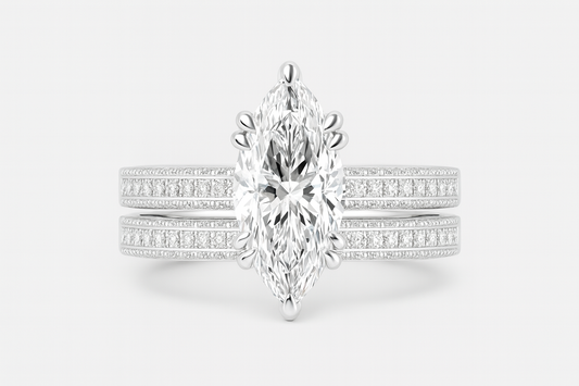 Diamond ring with a marquise-shaped center stone on a white background