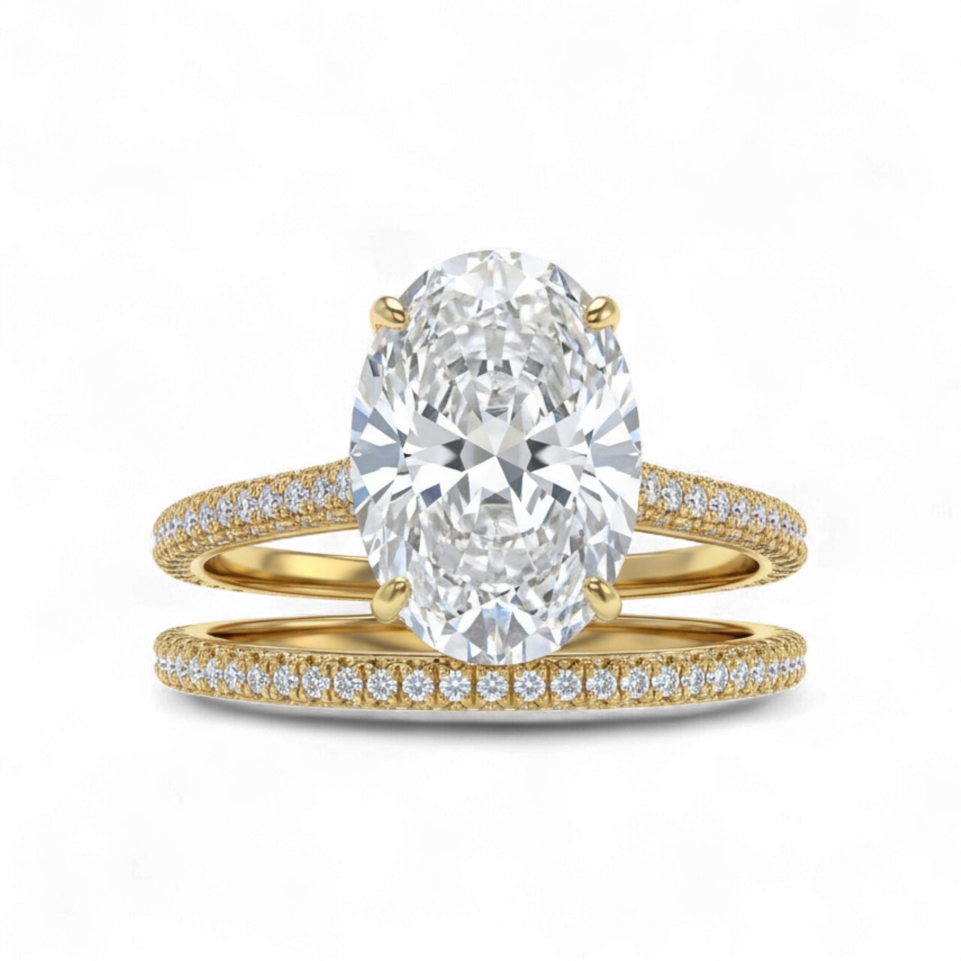Gold ring with a large diamond and smaller diamonds on the band against a white background