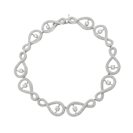 Silver necklace with intricate design on a white background