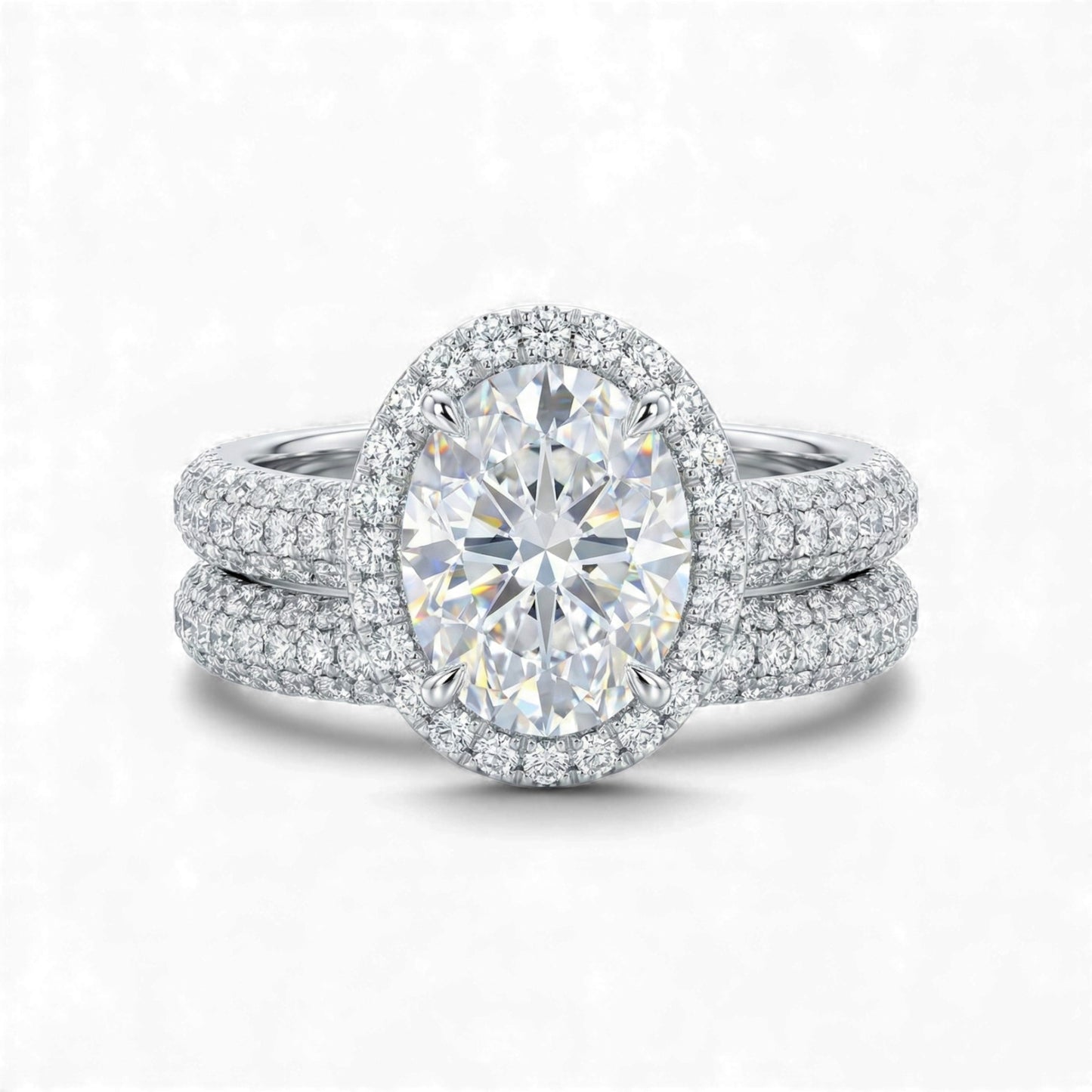 Diamond ring with a large central gemstone and smaller stones on a white background