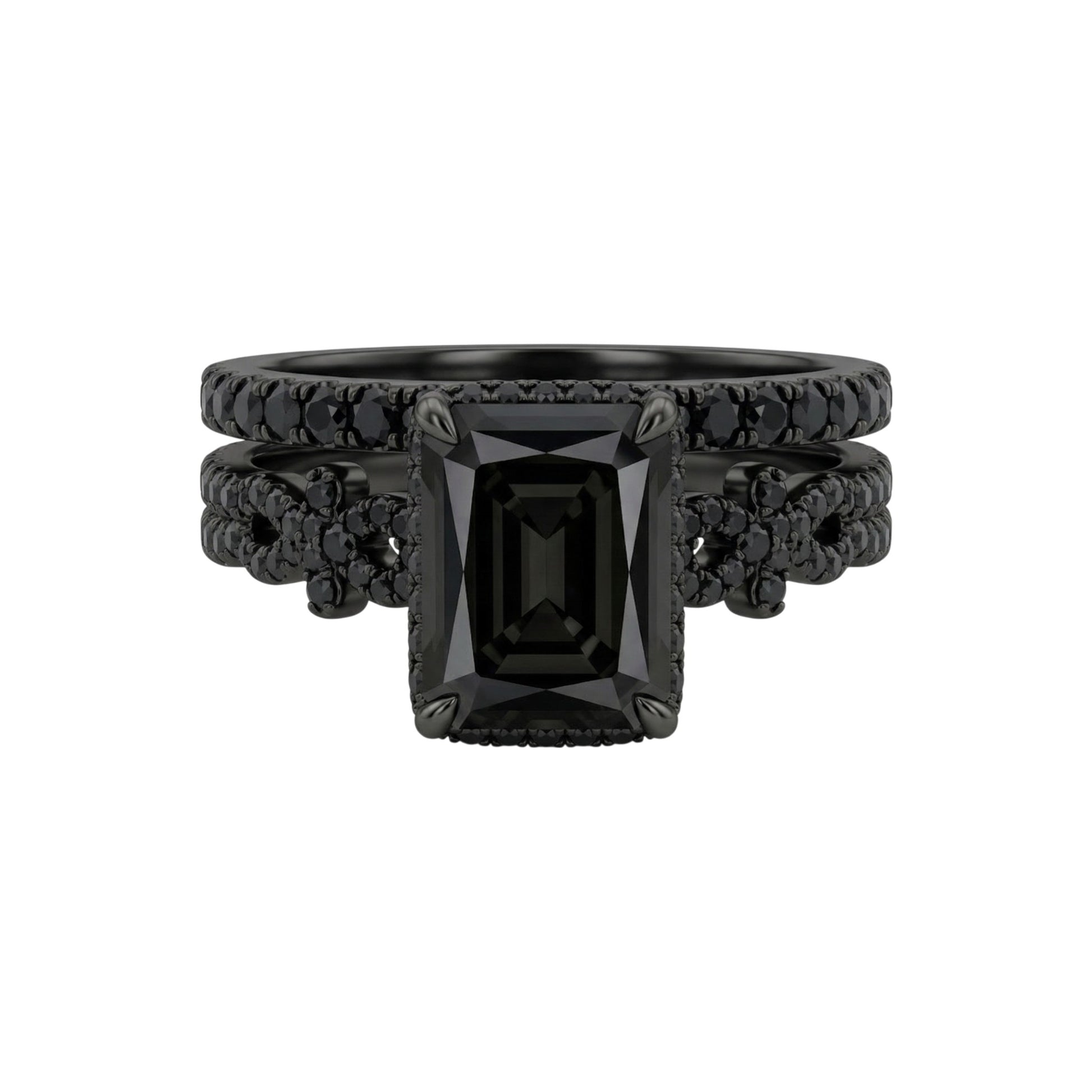 Black gemstone ring with intricate design on a white background