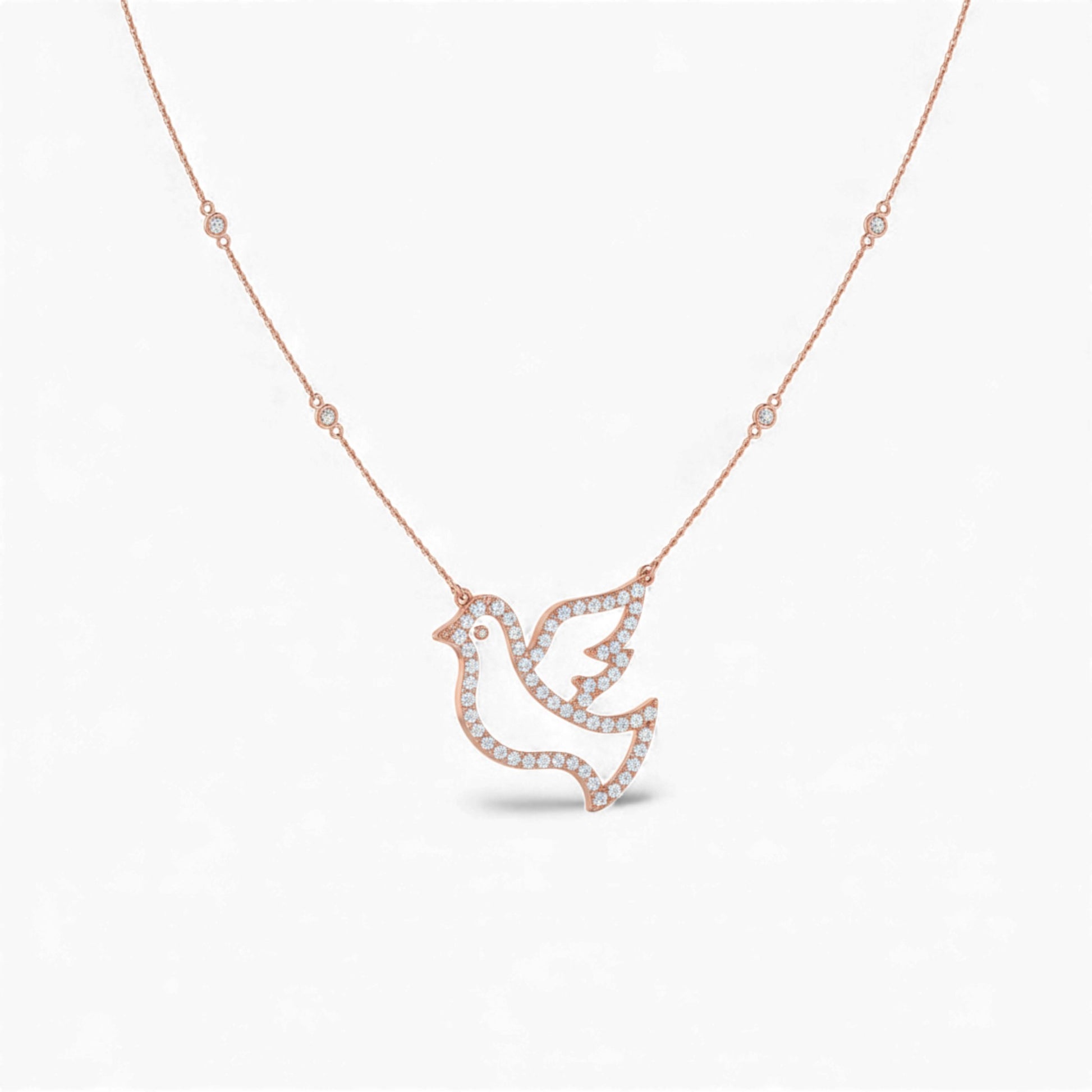 Rose gold necklace with a dove-shaped pendant on a white background