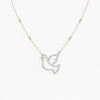 Gold necklace with a dove-shaped pendant on a white background