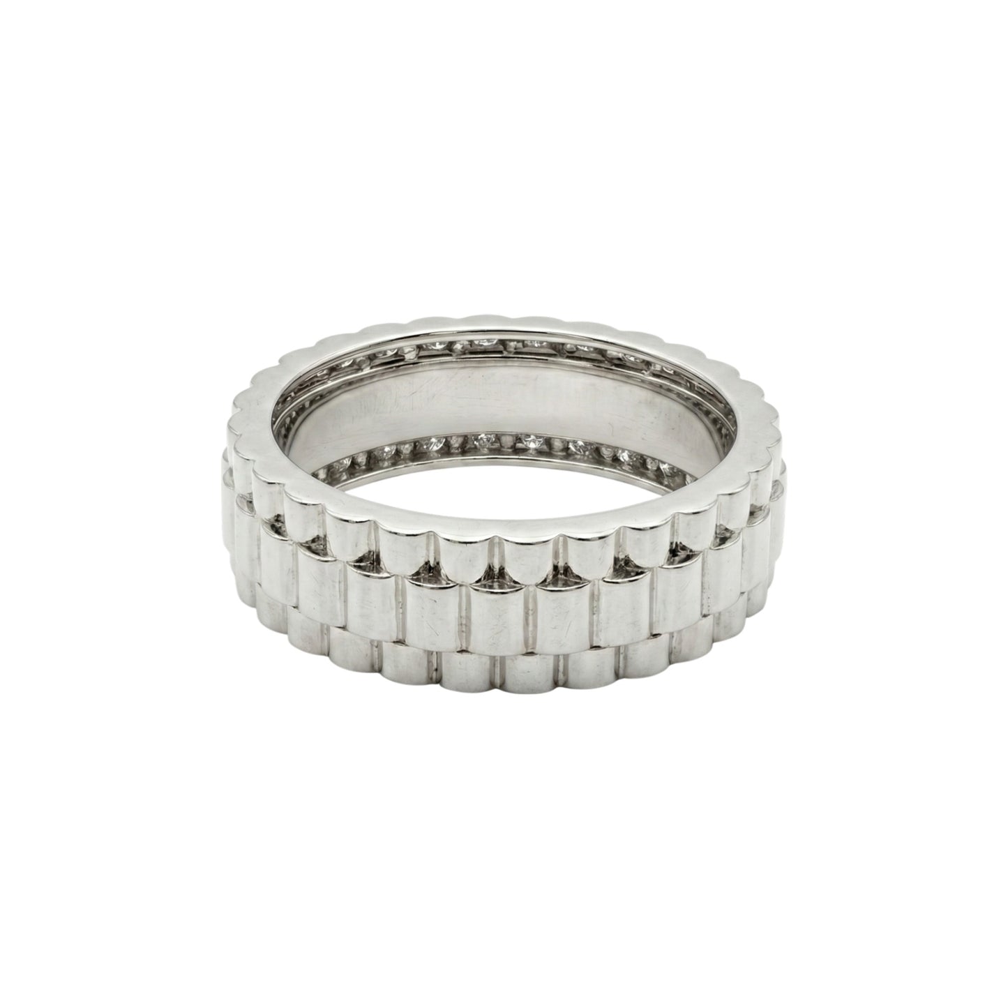 Silver ring with a textured band on a white background