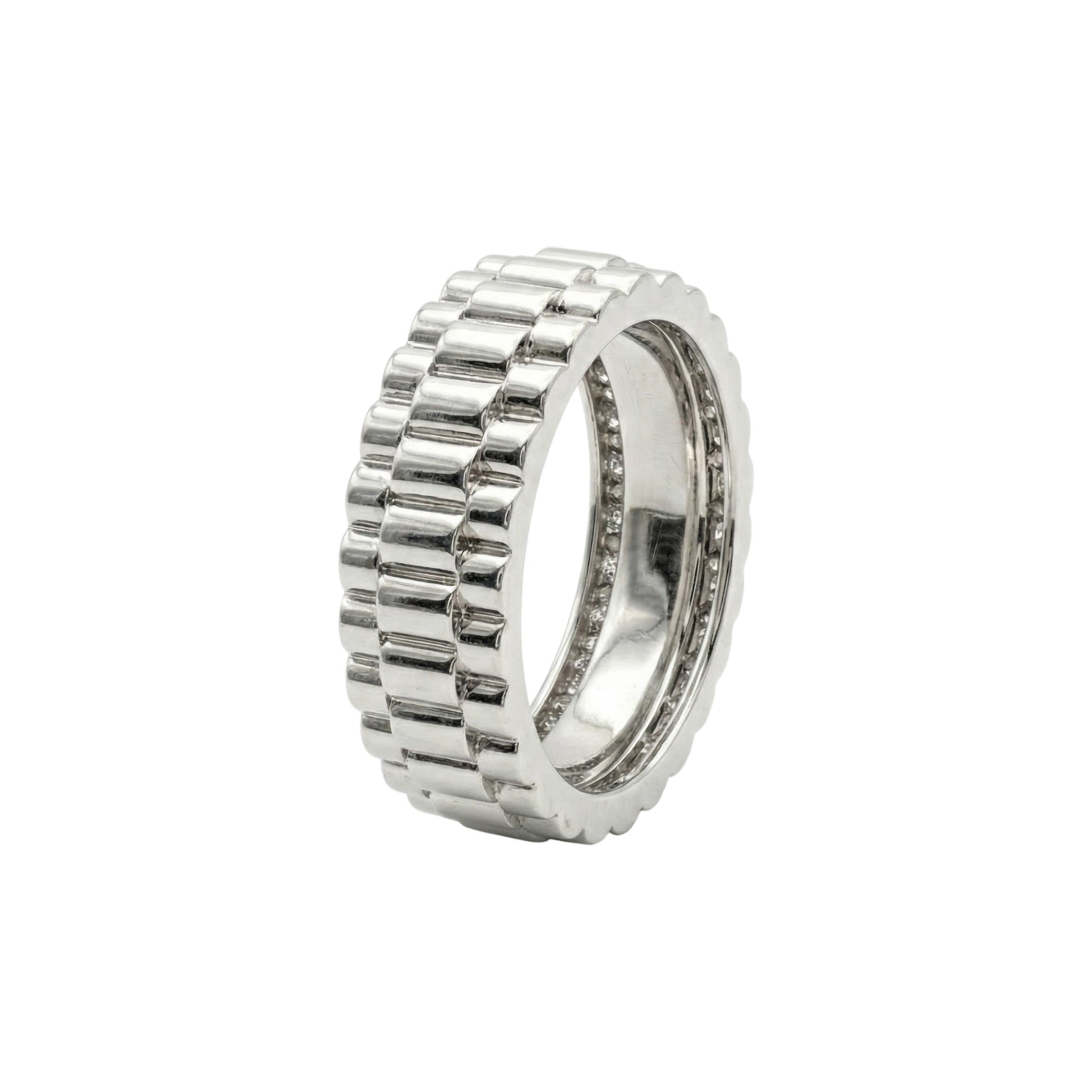 Silver ring with a textured band on a white background