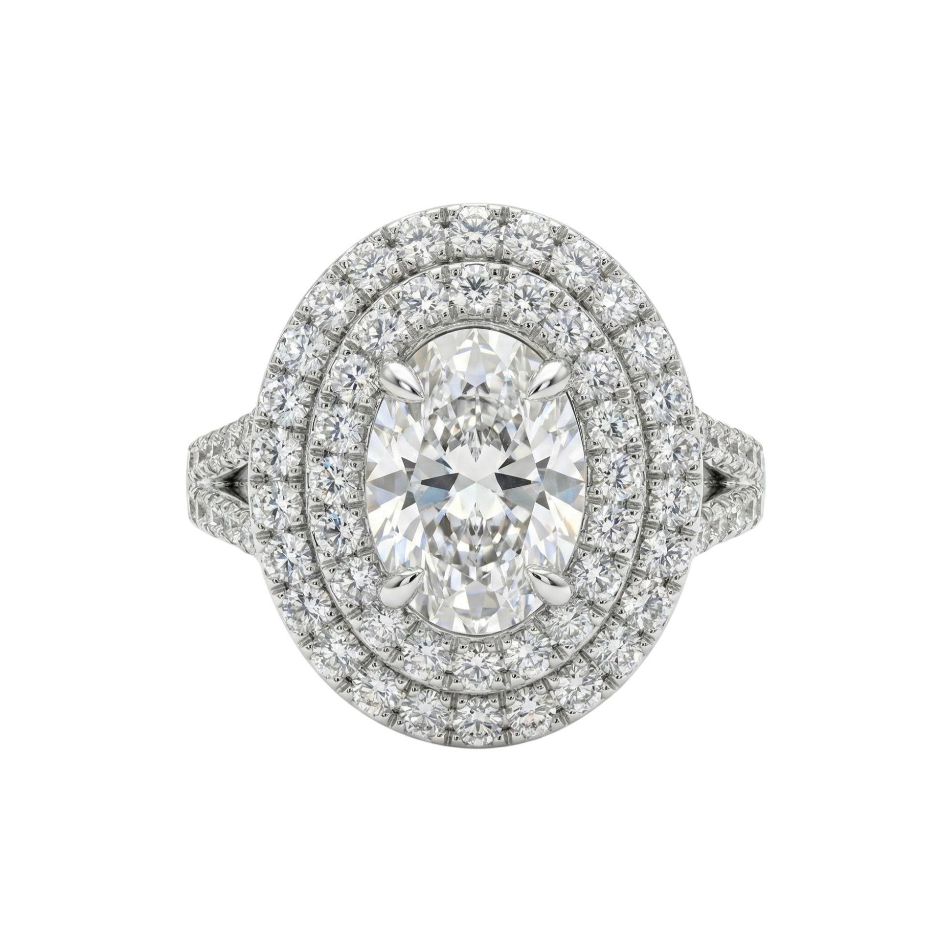 Diamond ring with a double halo on a white background