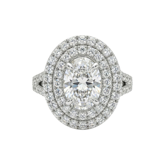 Diamond ring with a double halo on a white background