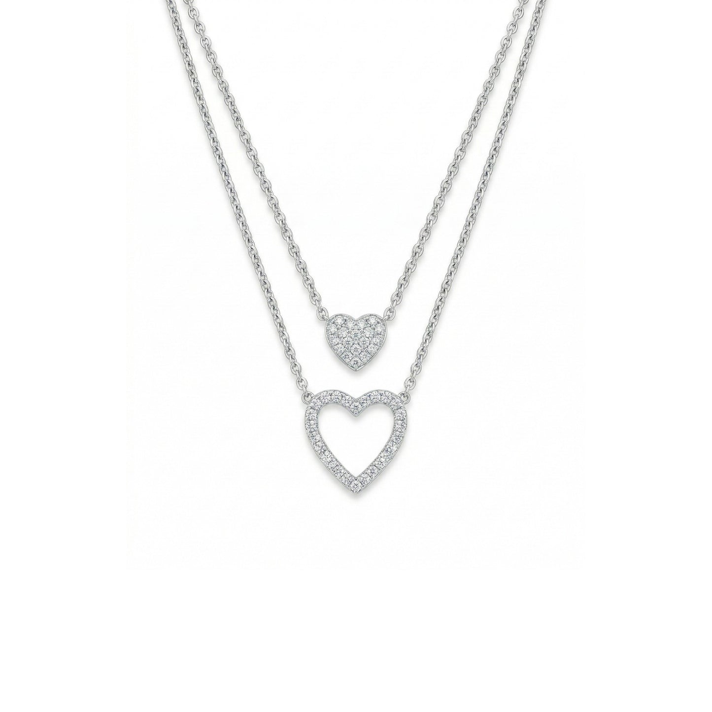 Two heart-shaped pendants on a chain against a white background
