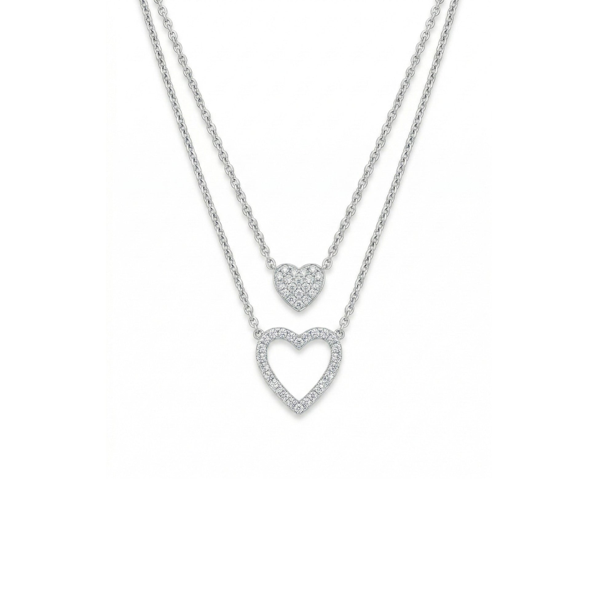 Two heart-shaped pendants on a chain against a white background