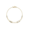 Gold bracelet with diamond accents on a white background