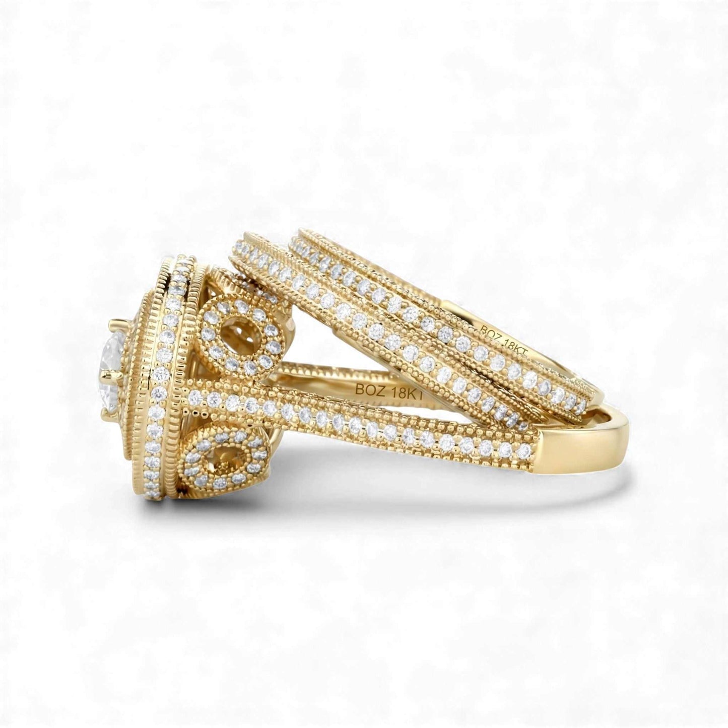 Gold ring with diamond accents on a white background