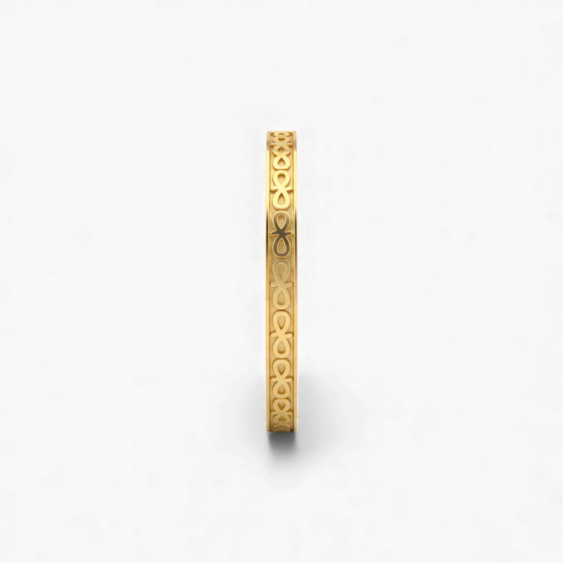 Gold bracelet with intricate design on a white background