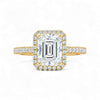 Gold and diamond ring with a large central gemstone on a white background