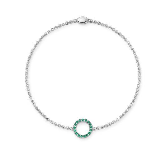 Silver bracelet with a green gemstone circle on a white background