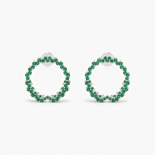 Pair of green hoop earrings on a white background