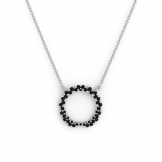 Necklace with a circular pendant made of black beads on a white background
