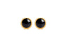 A pair of 18karat gold stud earrings with black onyx centers, surrounded by gold filigree designs.