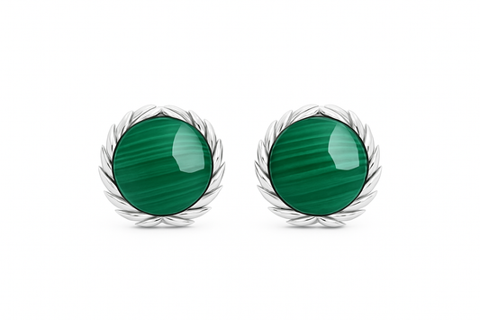 Pair of green circular earrings with silver rims on a white background