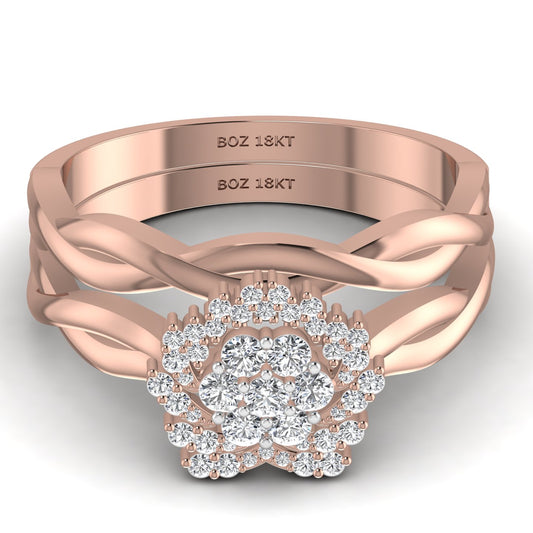 A set of two 18K gold rings with natural diamonds set in them, indicating a bridal set design.