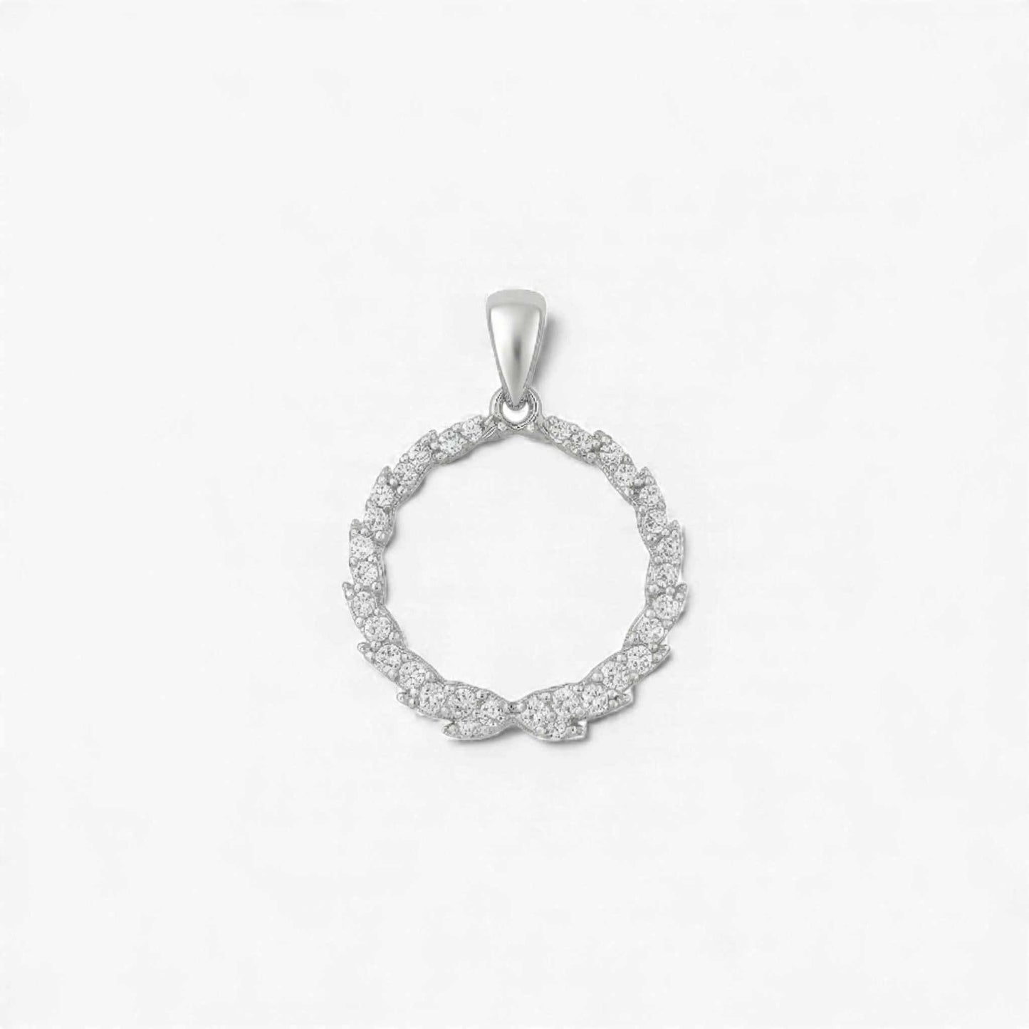 Silver circular pendant with small diamonds on a light gray background