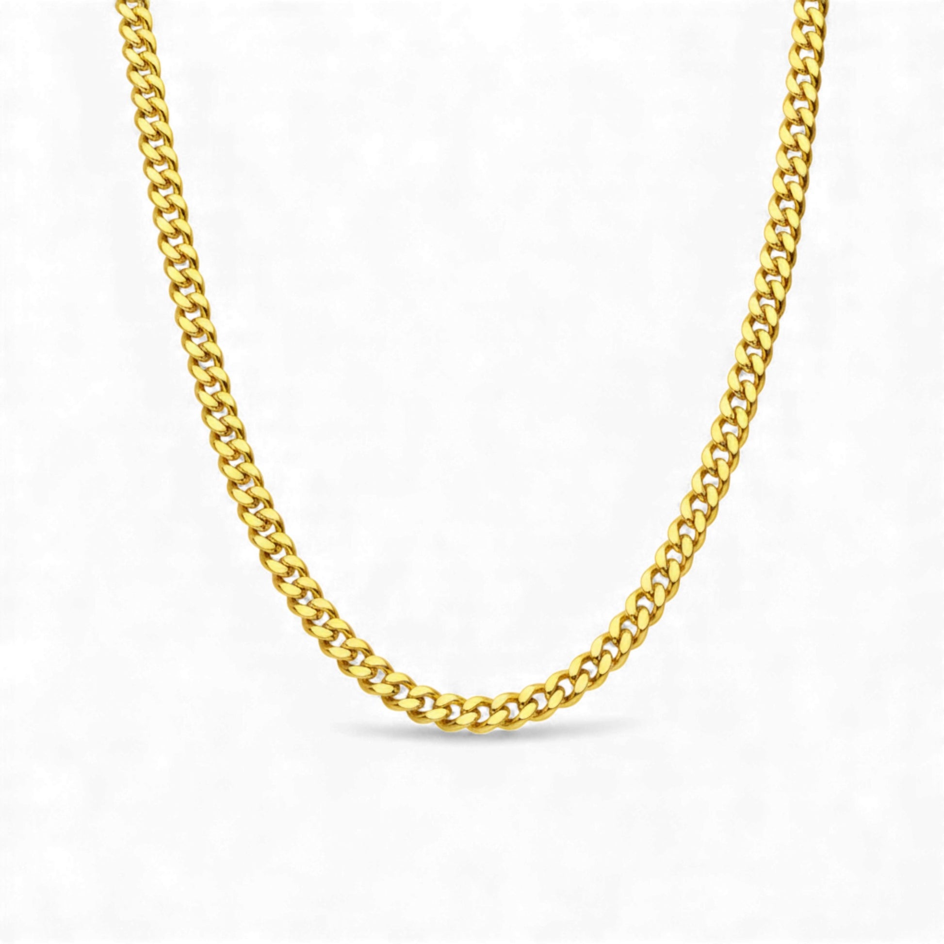 Gold chain necklace on a white background