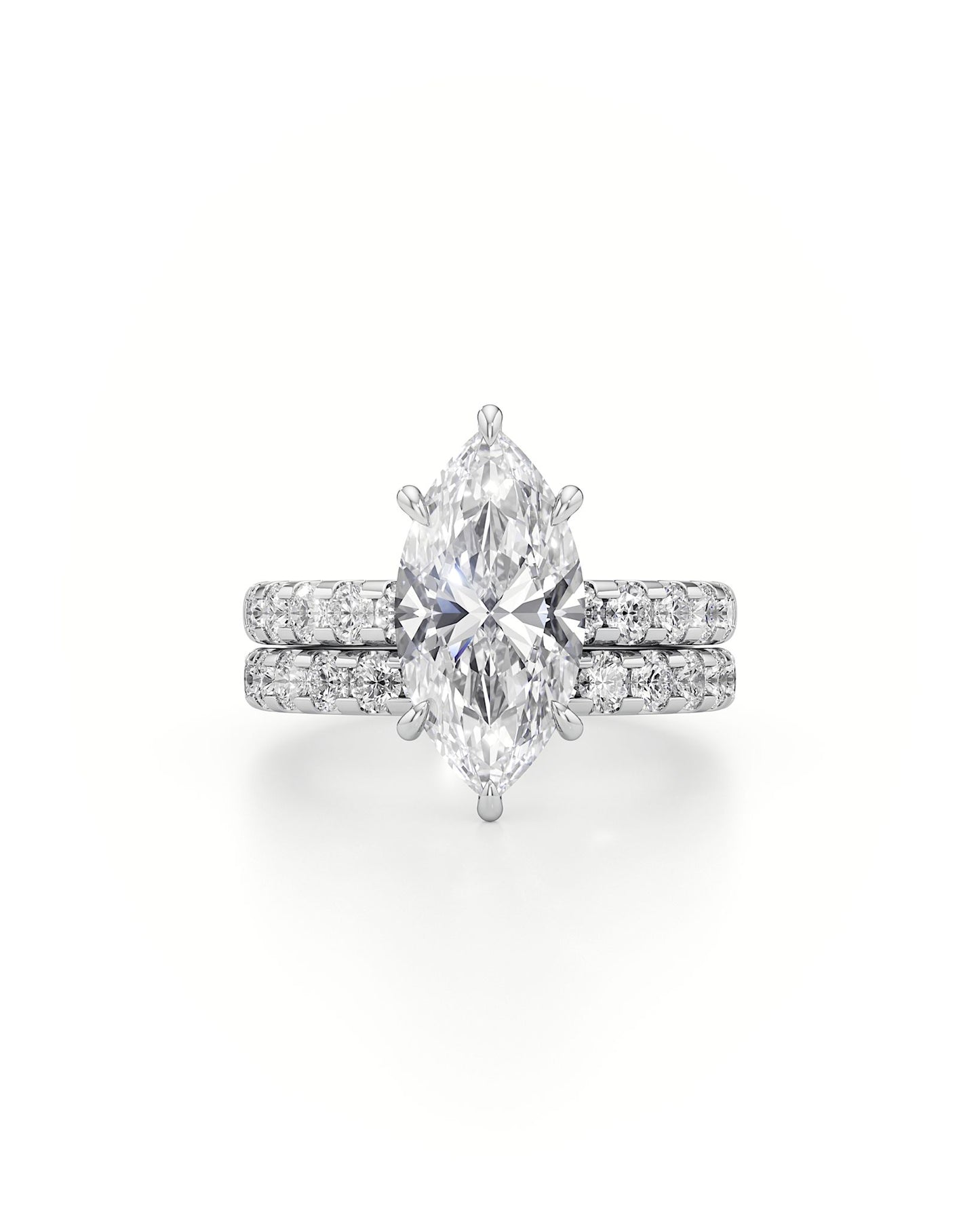 Diamond ring with pear-shaped center stone on a white background