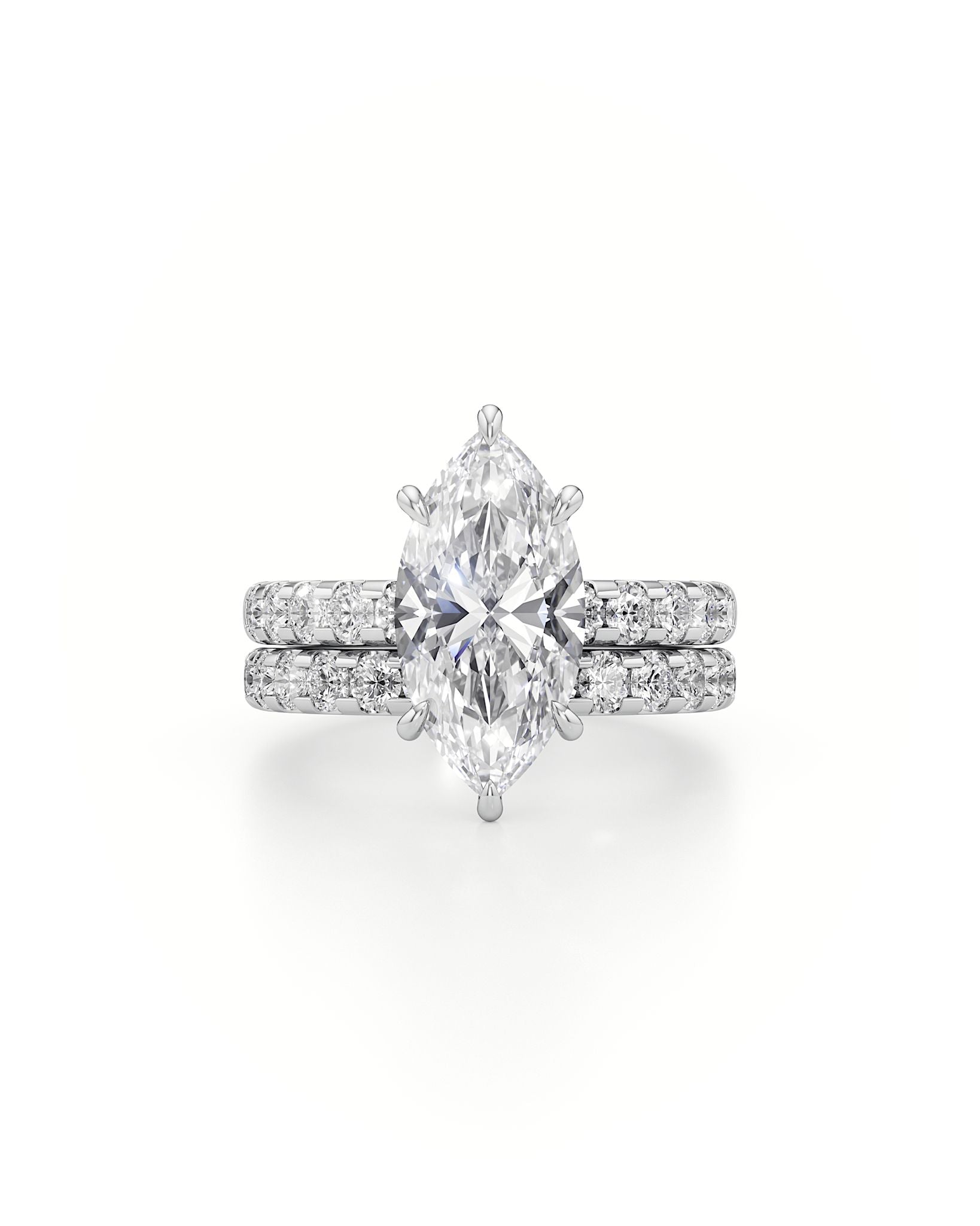 Diamond ring with pear-shaped center stone on a white background