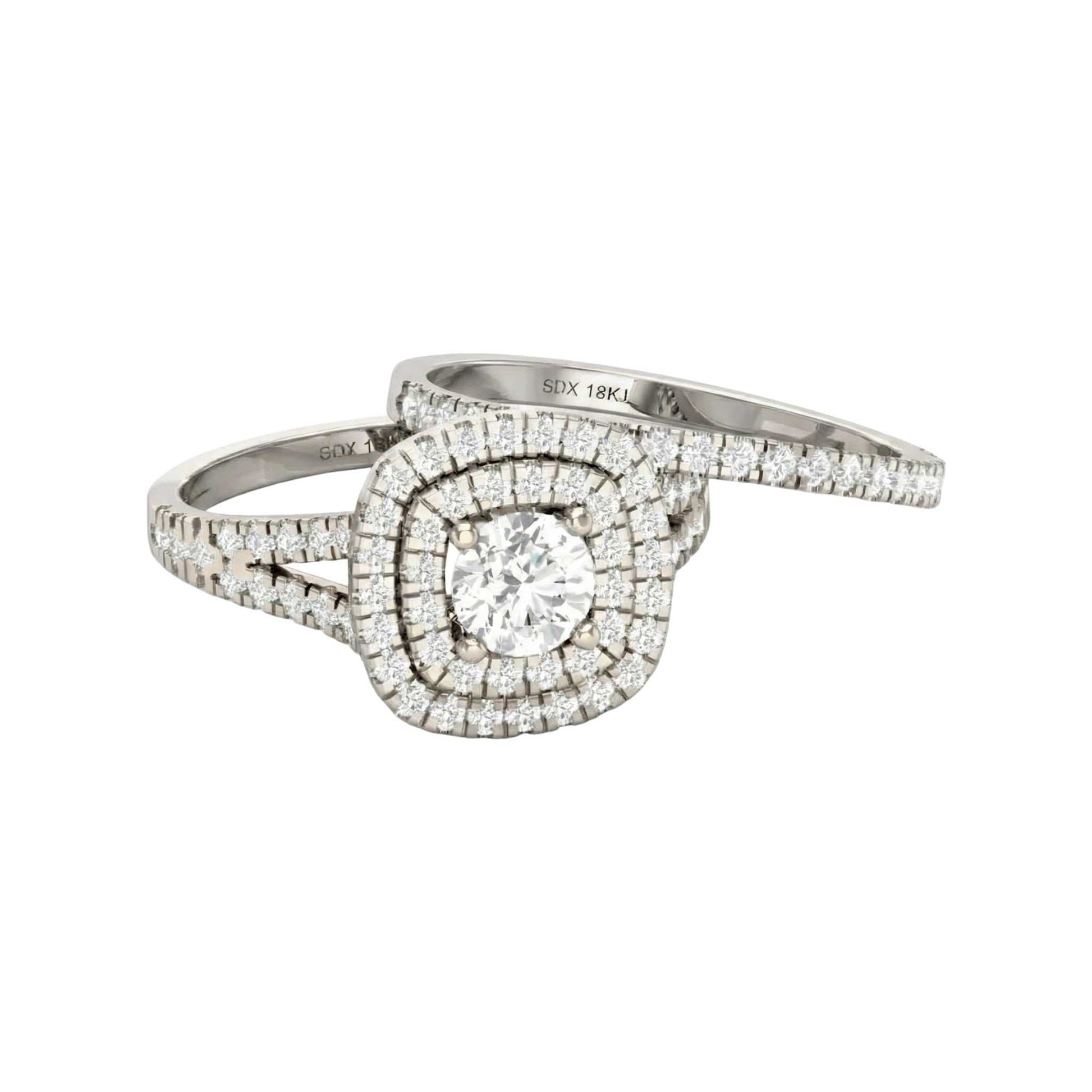 Diamond ring with a white gold band on a white background