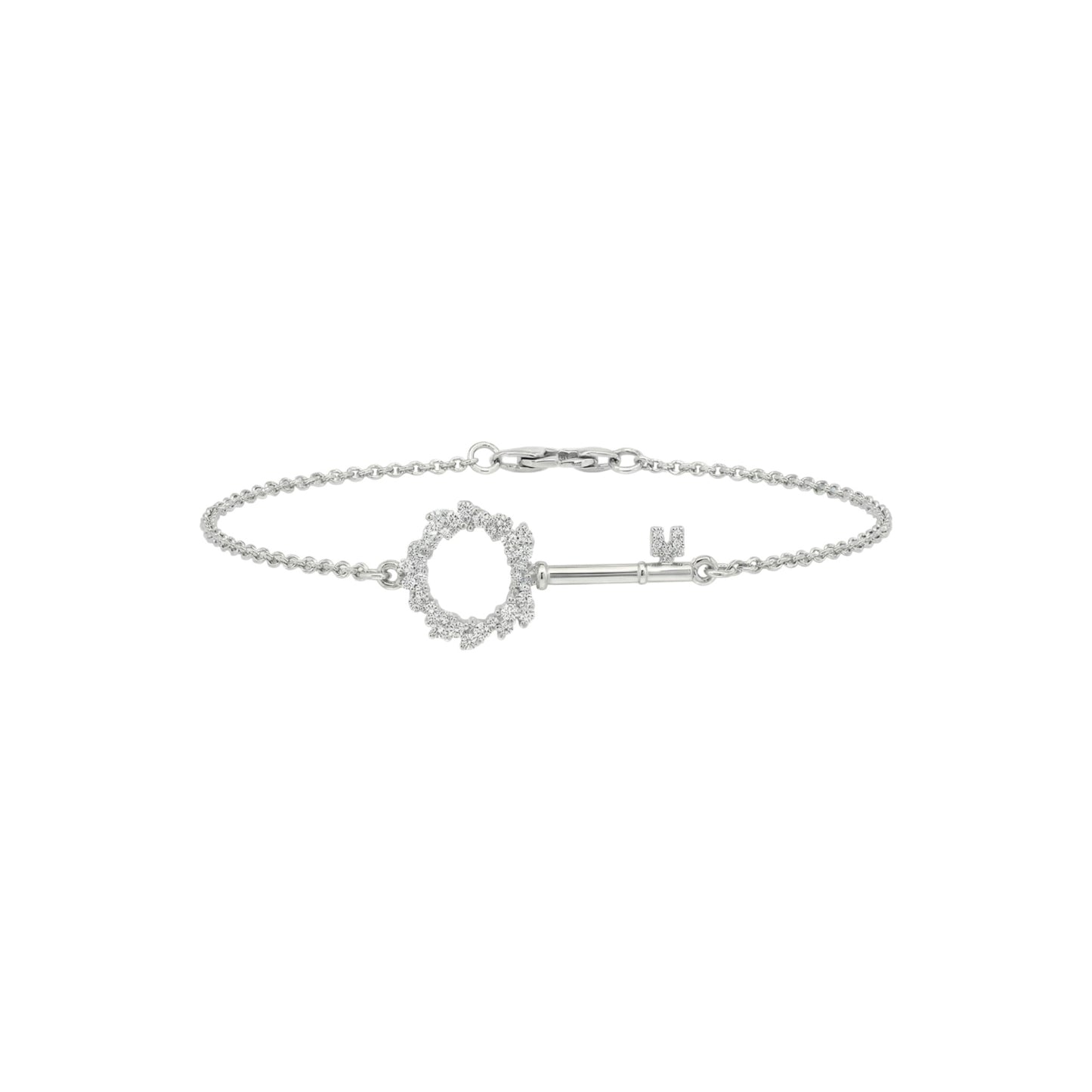 Silver bracelet with a key-shaped clasp on a white background