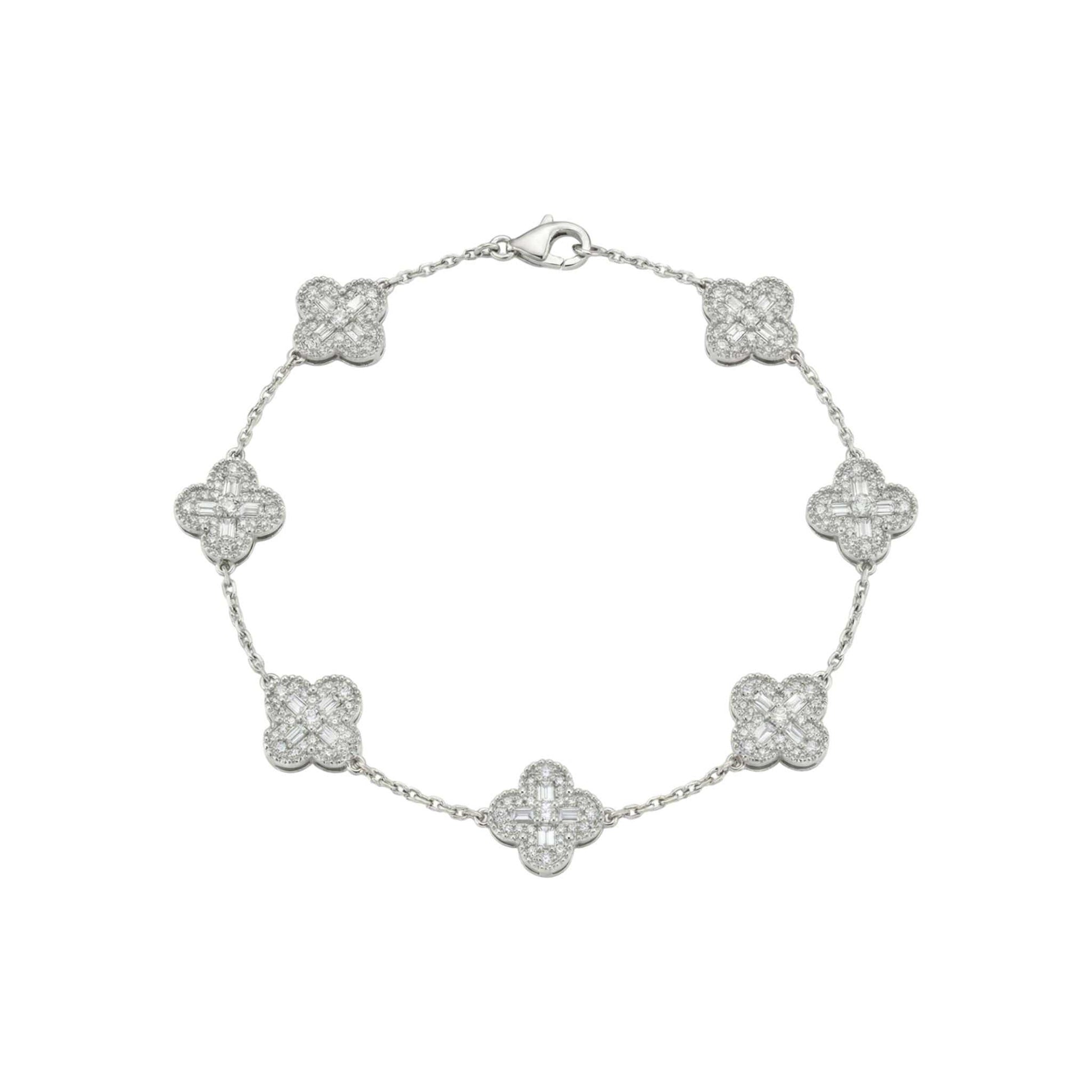 Silver bracelet with clover-shaped charms on a white background